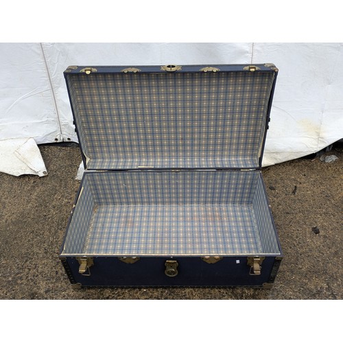 455 - A vintage canvas overpond storage trunk in blue