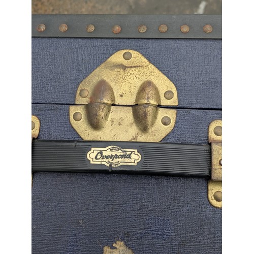 455 - A vintage canvas overpond storage trunk in blue