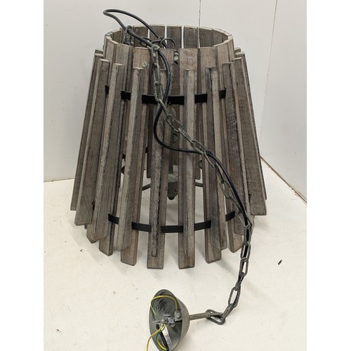 859 - An interesting steel and oak cylindrical hanging light fixture with an internal 3 branch light holde... 