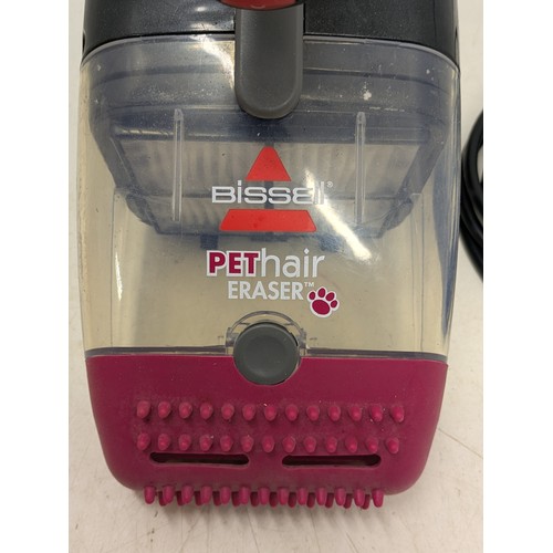 1279 - A Bossell pet hair eraser handheld vacuum - working