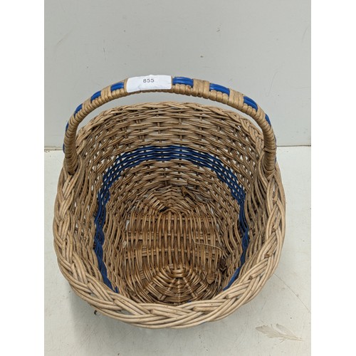 855 - A wicker hamper basket with blue accents