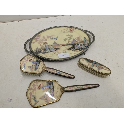 863 - An oriental Japanese style dressing table set with mirror, brushes and tray