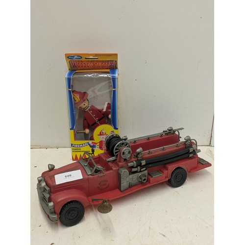 869 - A Vintage Circa 1950s Mettoy Fire engine with a boxed fireman puppet