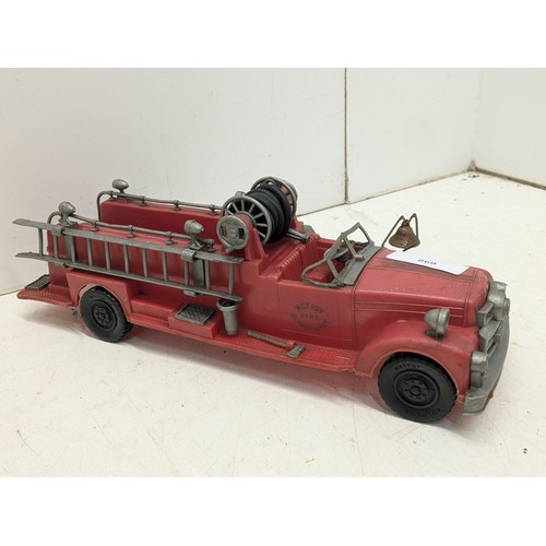 869 - A Vintage Circa 1950s Mettoy Fire engine with a boxed fireman puppet