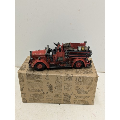 868 - A Popular imports Inc 1999 figure if an American Fire engine in original box