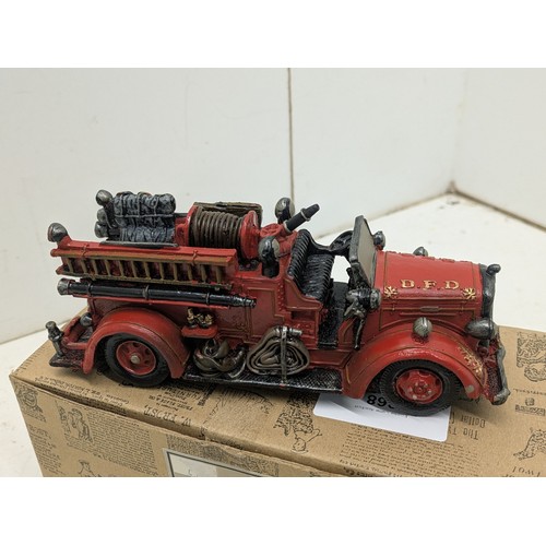 868 - A Popular imports Inc 1999 figure if an American Fire engine in original box