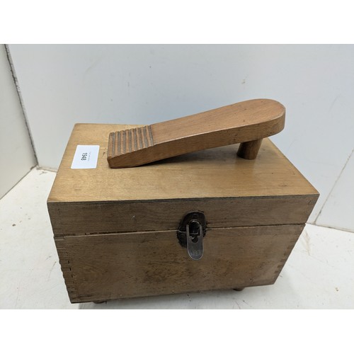 1948 - A shoe shine box with a selection of brushes and polishes