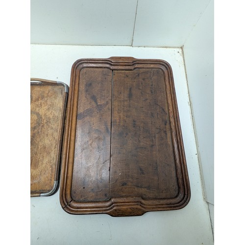 1053 - A pair of vintage oak service trays