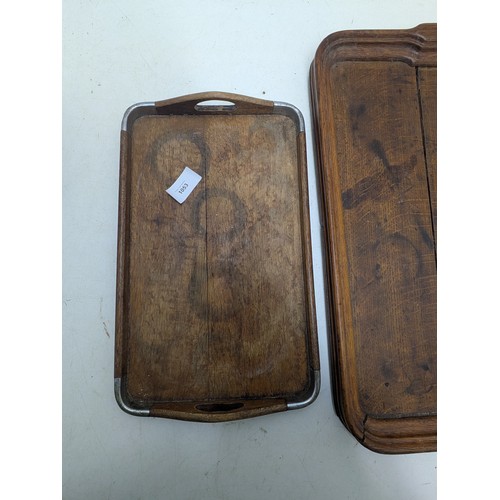 1053 - A pair of vintage oak service trays