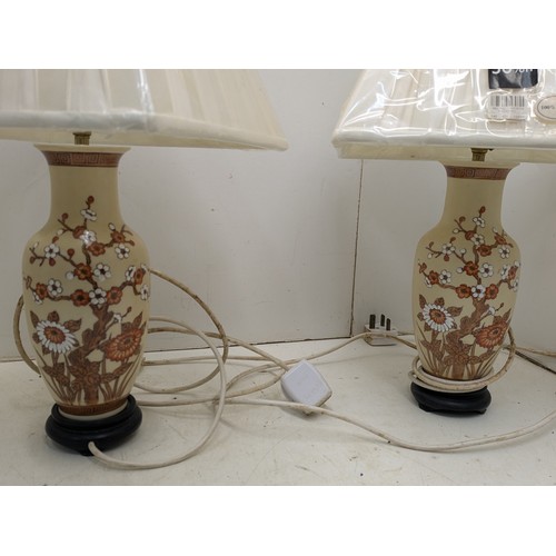 456 - A pair of oriental inspired lamps with brand new silk shades