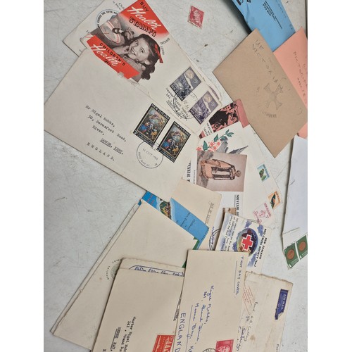 240 - A shoe box of first day covers and envelopes of stamps