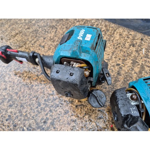 246 - A pair of Makita Petrol Strimmer heads - both EY265oh