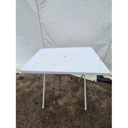 218 - A plastic folding outdoor table