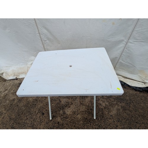 218 - A plastic folding outdoor table