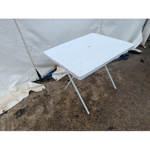 218 - A plastic folding outdoor table