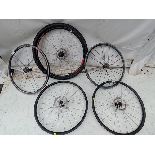 222 - A selection of road/mountain bike wheels including a 29 inch voodoo wheel with kenda tyre