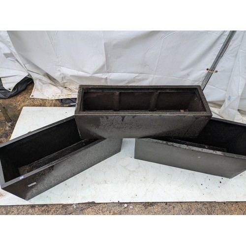 19 - A Selection of 3 fibre glass garden planters