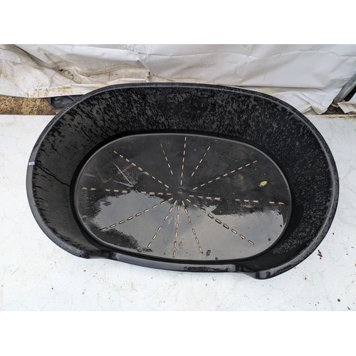 26 - A large plastic dog bed