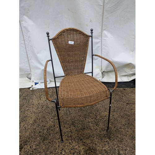 525 - A stylish wicker cafe chair with metal frame