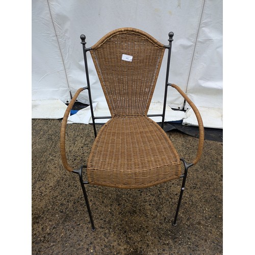 525 - A stylish wicker cafe chair with metal frame