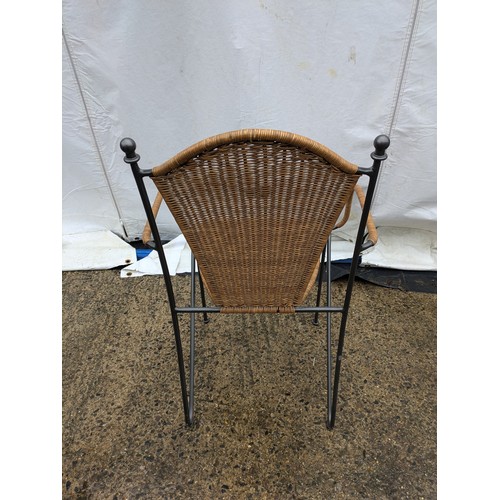 525 - A stylish wicker cafe chair with metal frame