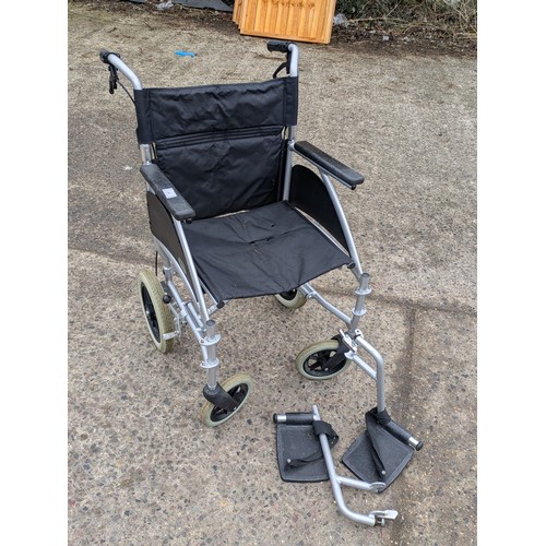 A Days collapsible wheelchair with foot rests