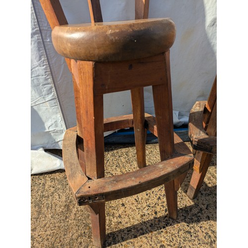 411 - A pair of tiki style barstools