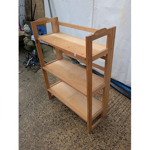 408 - A natural pine folding bookcase