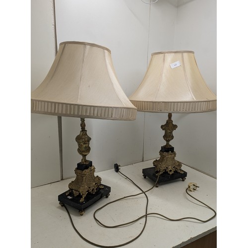 434 - A pair of ornate brass coloured table lamps