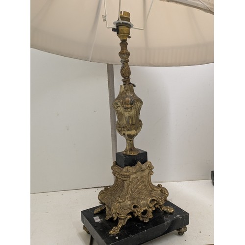 434 - A pair of ornate brass coloured table lamps