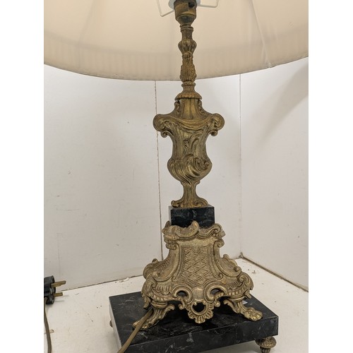 434 - A pair of ornate brass coloured table lamps