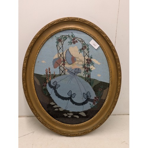 875 - An early 20th century sampler of a woman in a gilt oval frame