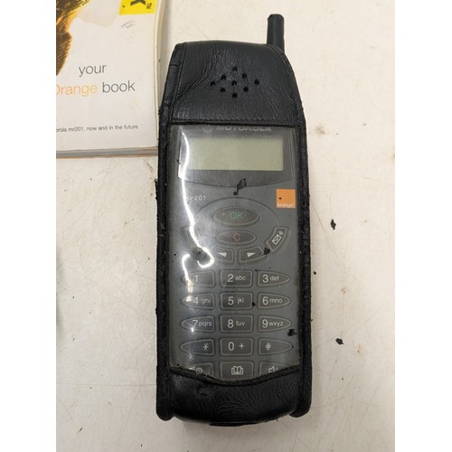 1277 - A retro Motorola mr201 mobile phone with charger and manual