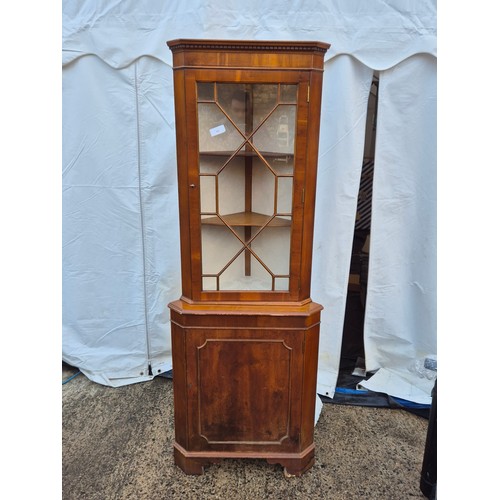 444 - A mahogany vernier corner display case with underlying drawer