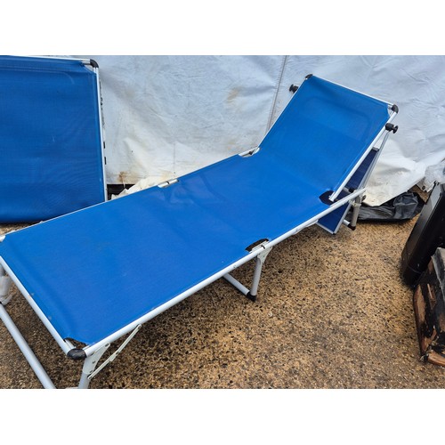 13 - A pair of metal framed sun loungers