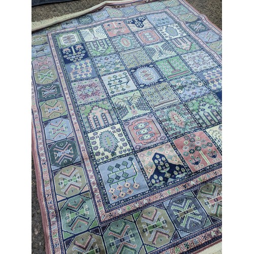 430 - A wool patterned area rug