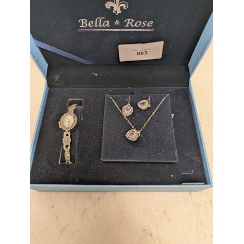 883 - A Bella and rose 3 piece jewellery set to include necklace, earrings and watch