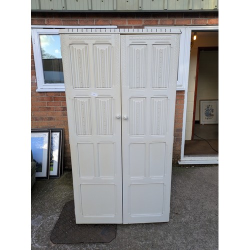 433 - An early 20th century oak wardrobe- painted white externally