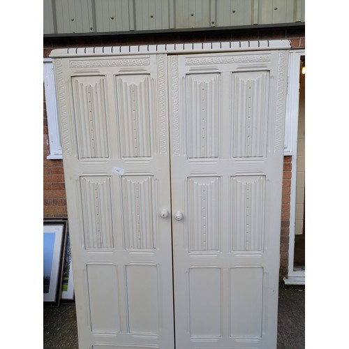 433 - An early 20th century oak wardrobe- painted white externally