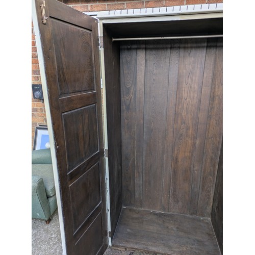 433 - An early 20th century oak wardrobe- painted white externally