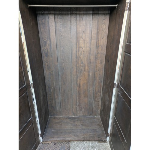 433 - An early 20th century oak wardrobe- painted white externally