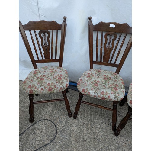 403 - A set of 4 oak dining chairs with floral padded seat bases