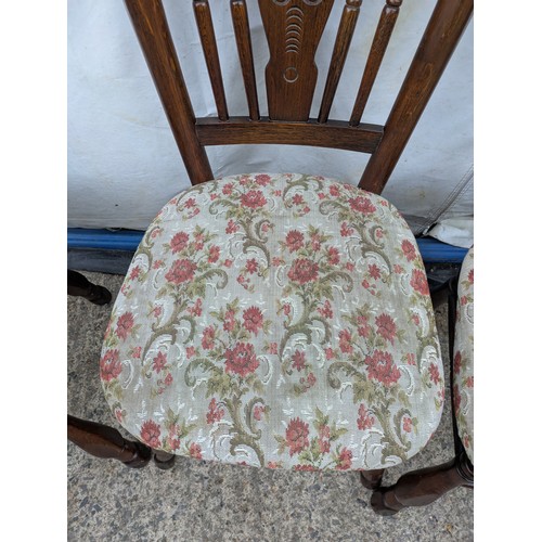 403 - A set of 4 oak dining chairs with floral padded seat bases