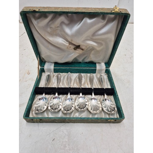 878 - A set of 6 silver plated spoons in a display case