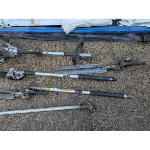 94 - A Titan petrol strimmer with a variety of attachments