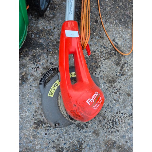 92 - A Flymo contour 500 corded strimmer and a Hawksmoor corded lawn mower