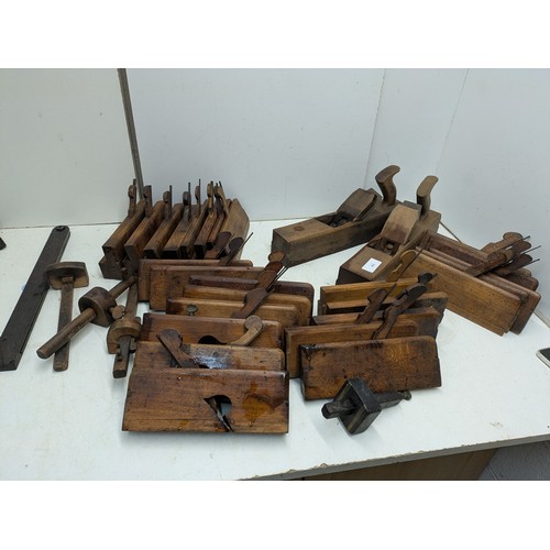 893 - A large selection of vintage wood hand planes and mortice and tenon measures