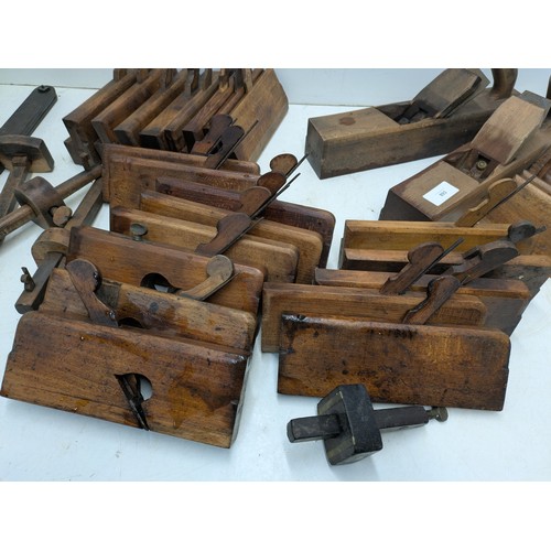 893 - A large selection of vintage wood hand planes and mortice and tenon measures