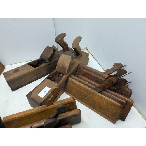 893 - A large selection of vintage wood hand planes and mortice and tenon measures