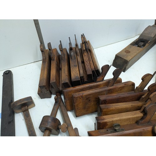 893 - A large selection of vintage wood hand planes and mortice and tenon measures